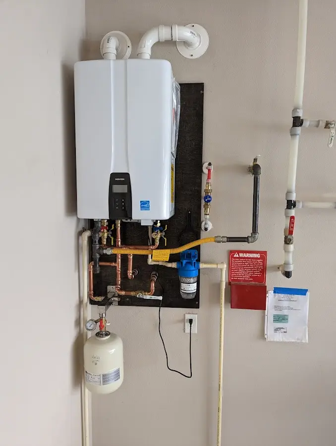 Professional plumber installing copper piping in a Kapolei home